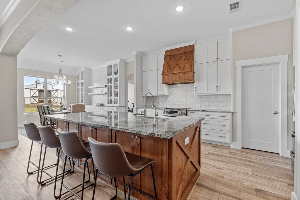 White kitchen with wood island